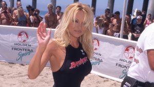 Why Pamela Anderson Fully Nodded At Her Baywatch Era In A Red Suit This Summer